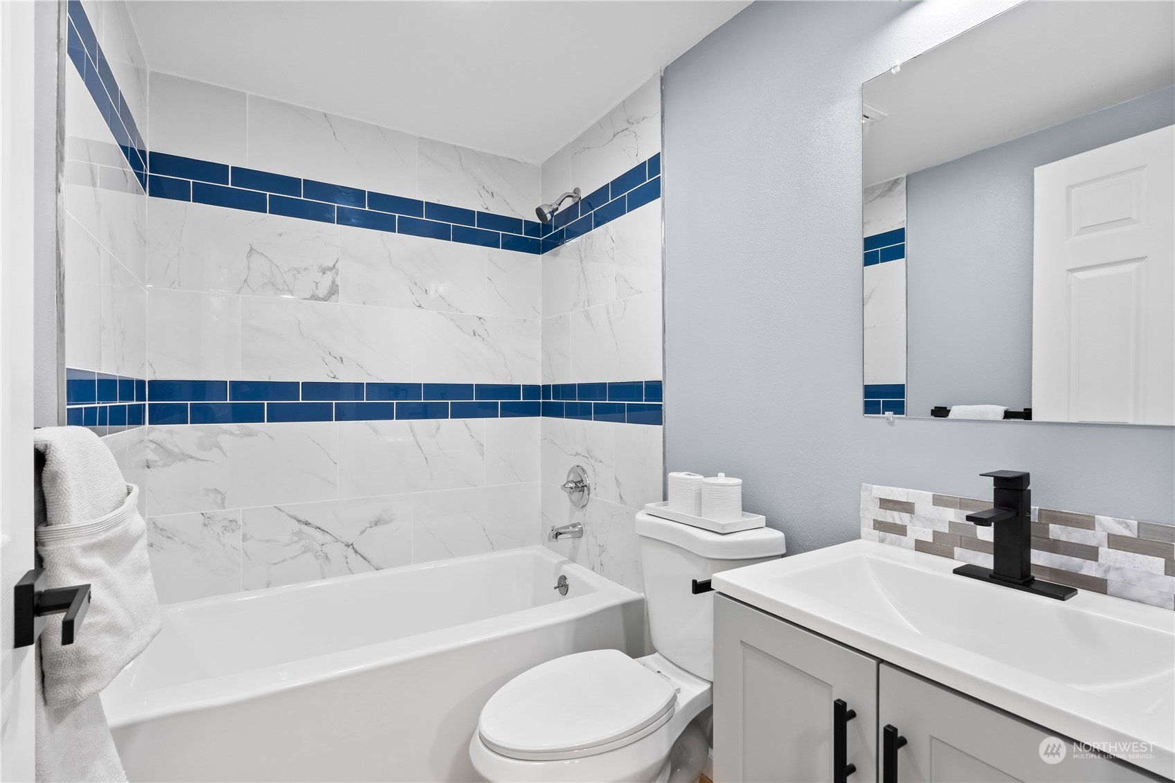 1909 Gary Street Sumner, WA 98390 - Photo 18 of 39 a bathroom with a sink a toilet and a bathtub