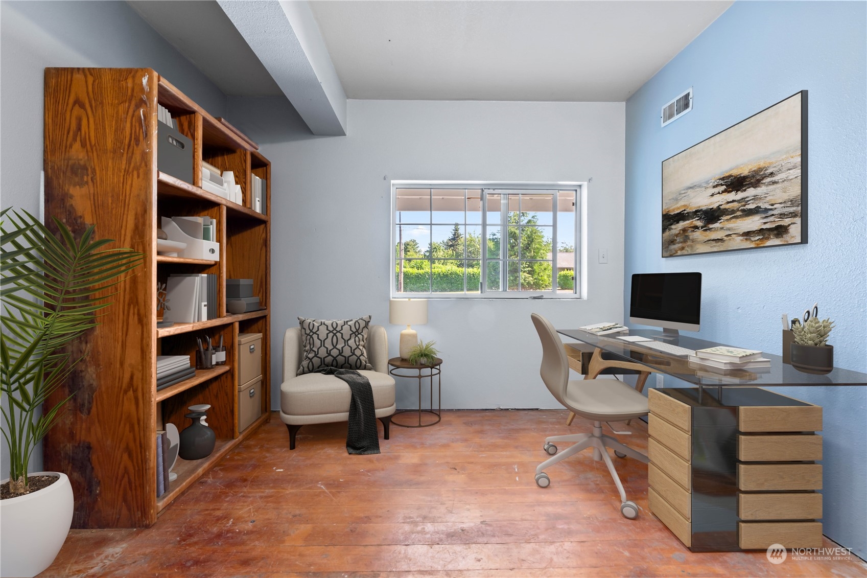 1909 Gary Street Sumner, WA 98390 - Photo 32 of 39 a view of a workspace with furniture and a bookshelf