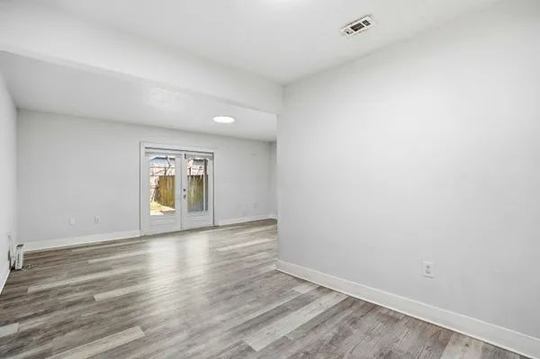 a kitchen with a sink cabinets appliances and a window