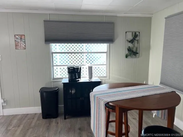 a bedroom with a bed and large mirror