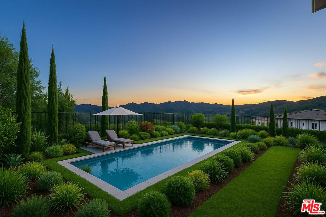 20668 Hummingbird Court Porter Ranch, CA 91326 - Photo 22 of 70 a view of a house with pool and a yard