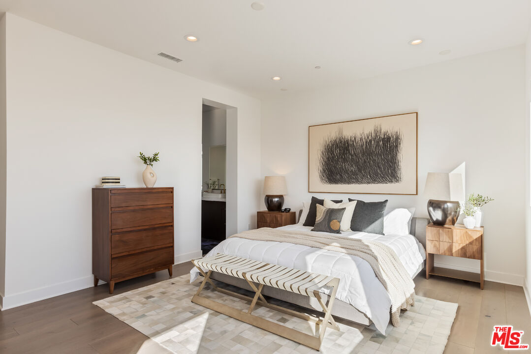 20668 Hummingbird Court Porter Ranch, CA 91326 - Photo 34 of 70 a bedroom with a bed and a dresser