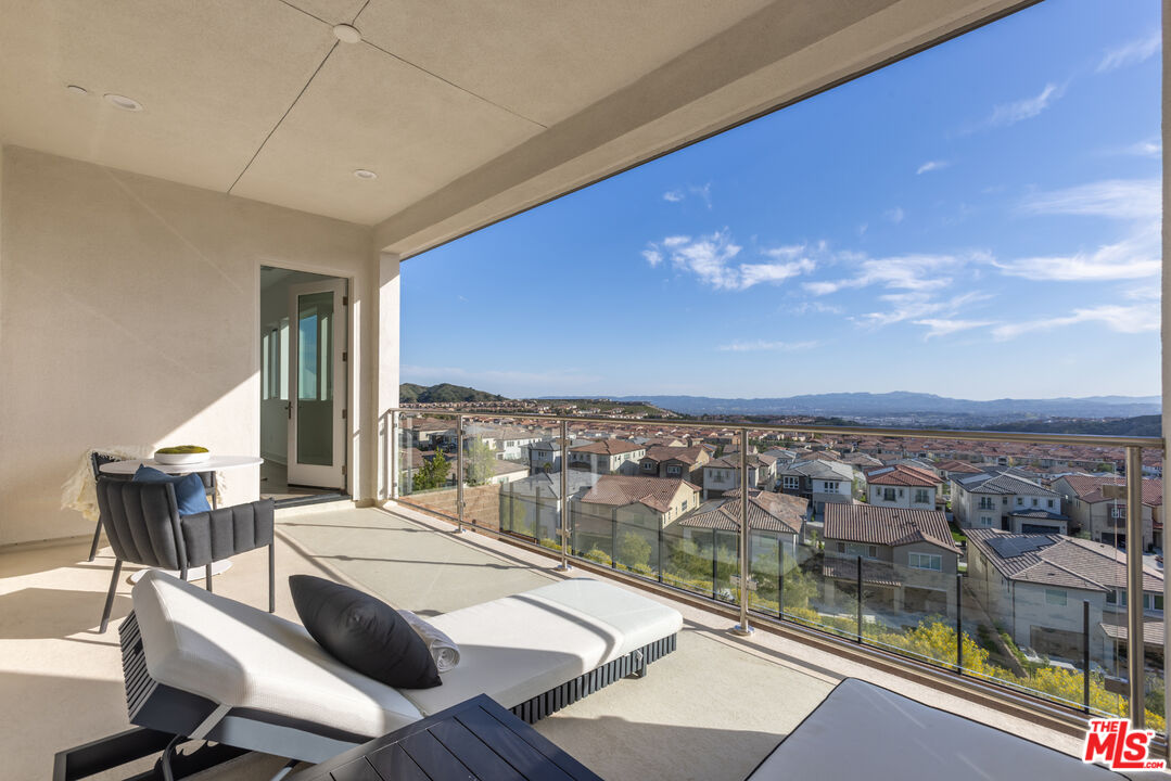 20668 Hummingbird Court Porter Ranch, CA 91326 - Photo 39 of 70 a view of a balcony with table and chairs