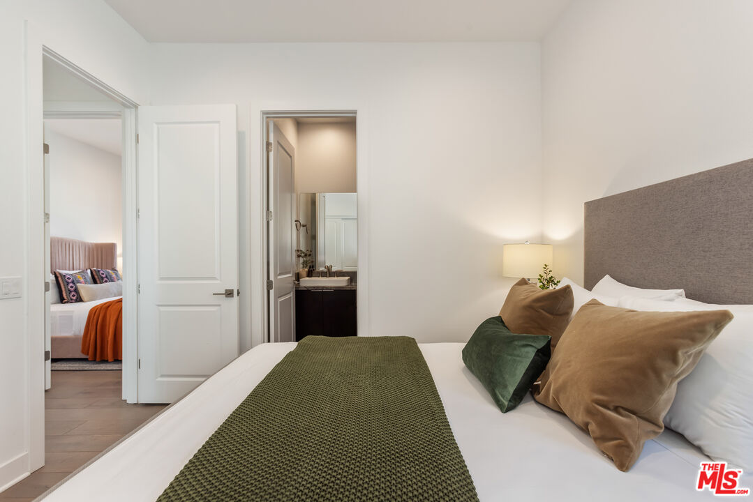 20668 Hummingbird Court Porter Ranch, CA 91326 - Photo 43 of 70 a bedroom with a bed and a lamp