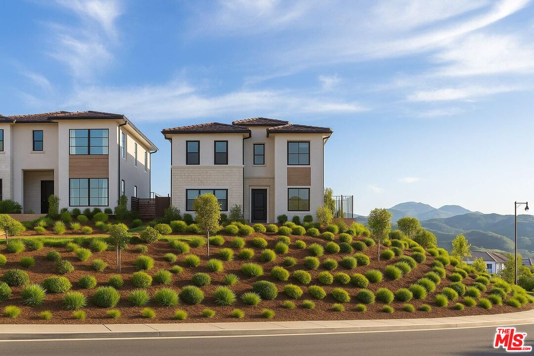 20668 Hummingbird Court Porter Ranch, CA 91326 - Photo 5 of 70 a front view of a house with a yard