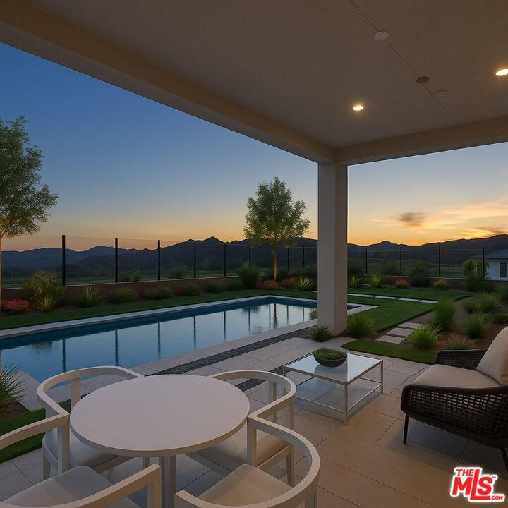 20668 Hummingbird Court Porter Ranch, CA 91326 - Photo 58 of 70 a view of a chairs and table in patio