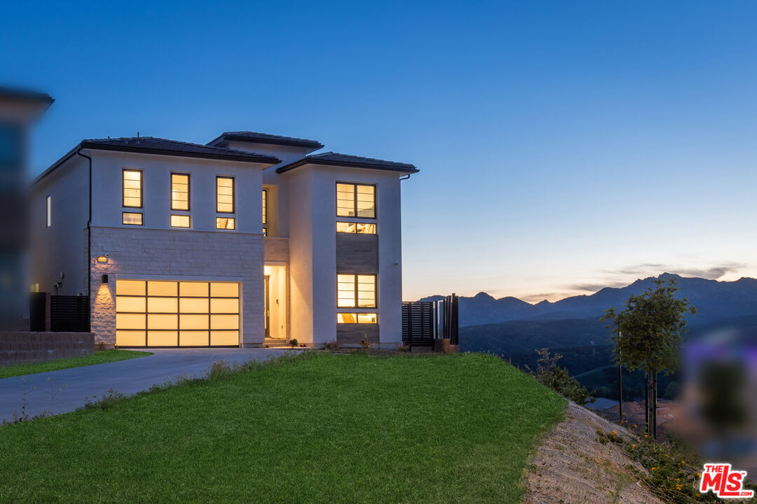 20668 Hummingbird Court Porter Ranch, CA 91326 - Photo 66 of 70 a front view of a house with a yard