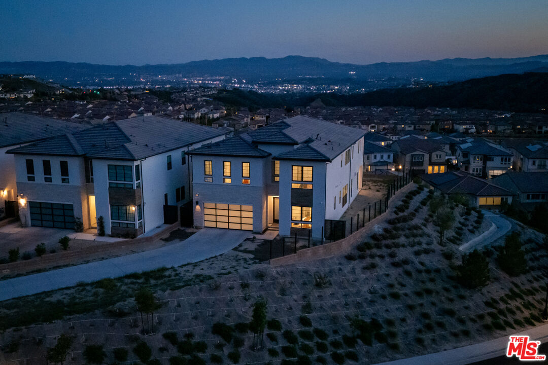 20668 Hummingbird Court Porter Ranch, CA 91326 - Photo 68 of 70 a view of a house with a yard