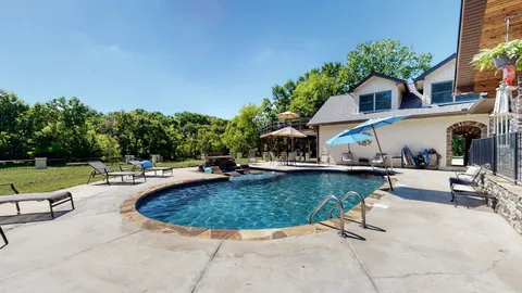 a view of a lake with a yard