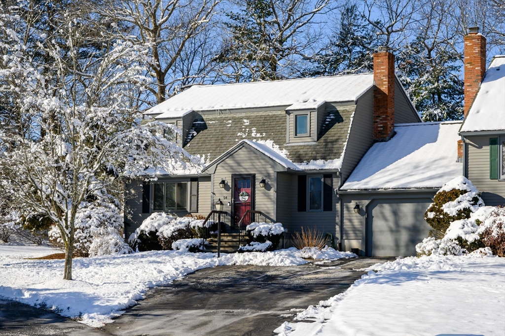 a view of a house with large windows