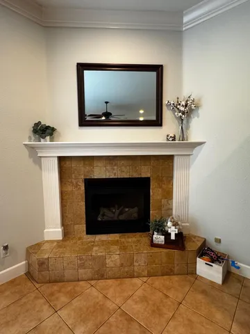 a living room with furniture a flat screen tv and a table