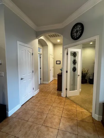 a kitchen with stainless steel appliances granite countertop a sink counter space and a view of living room