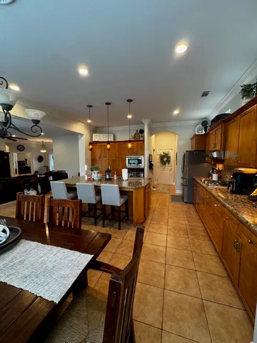 a view of a hallway with closet and mirror