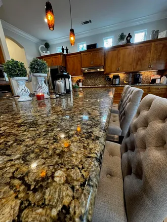 a kitchen with a refrigerator and a sink