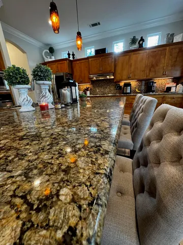 a kitchen with a refrigerator and a sink