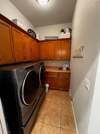 a bathroom with a toilet and a shower curtain