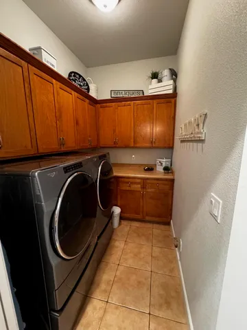a bathroom with a toilet and a shower curtain