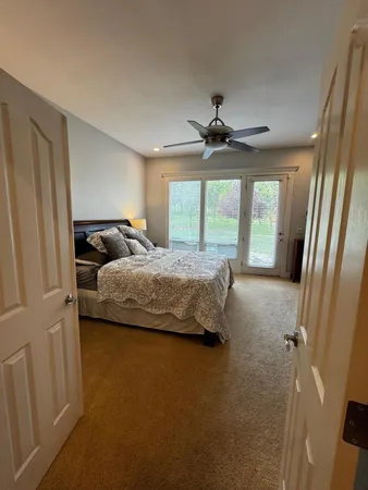 a bedroom with bed and window