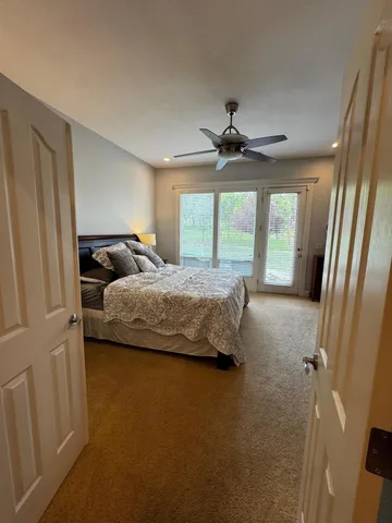 a bedroom with bed and window