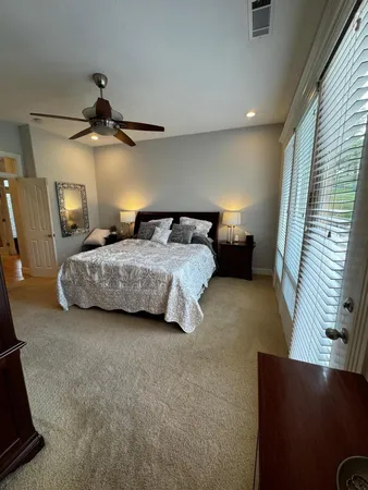 a bedroom with a bed and a television