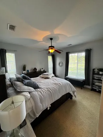 a view of a golf course with a house