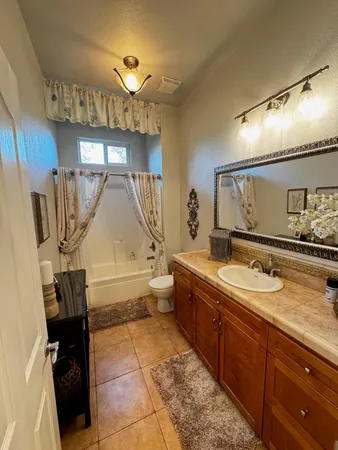 a view of a house with yard and a garden