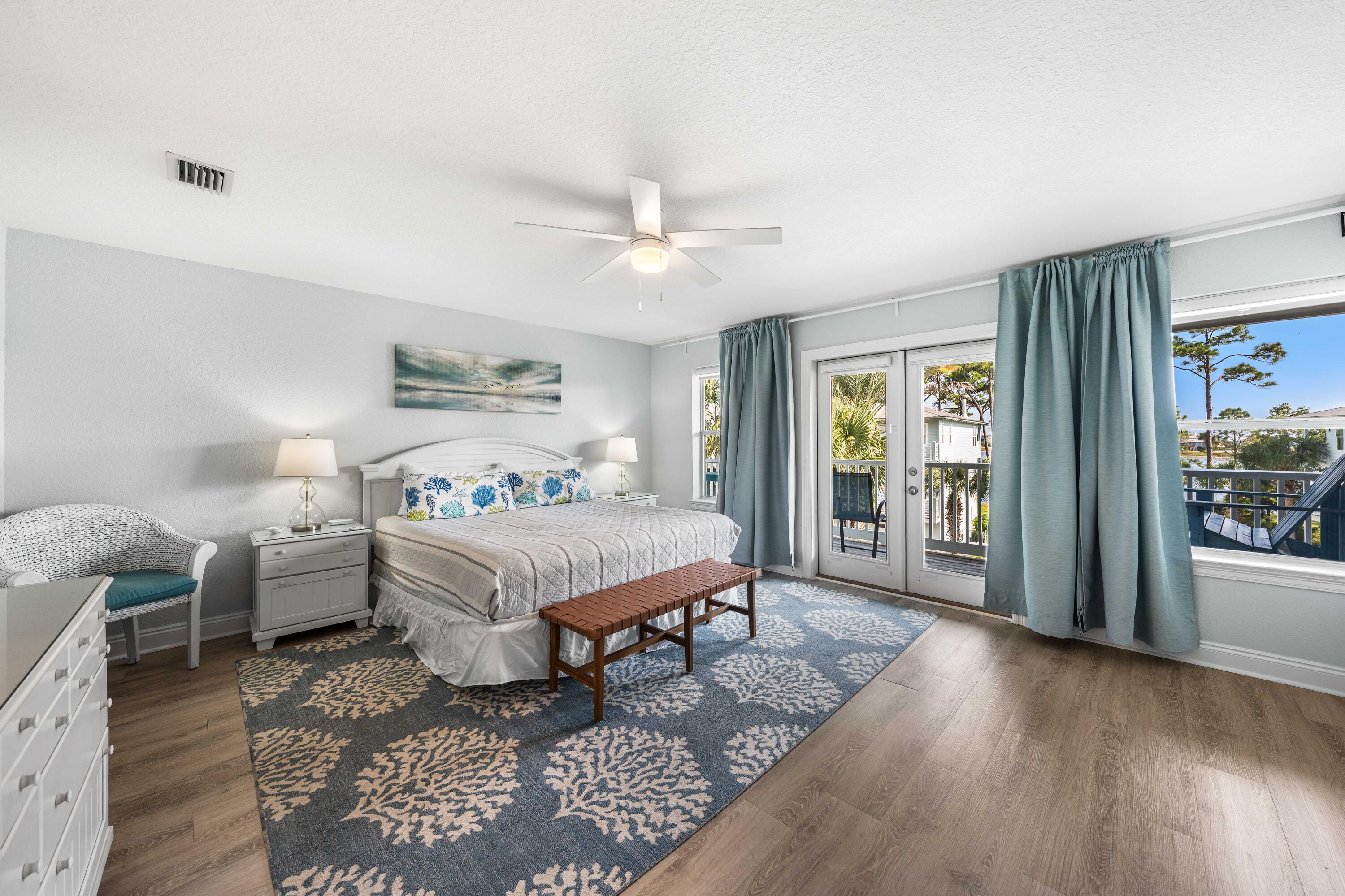 33 Dune Breeze Lane, Unit H2 Santa Rosa Beach, FL 32459 - Photo 15 of 54 a spacious bedroom with a bed and wooden floor