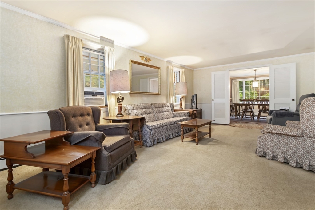 33 Wing Road Lynnfield, MA 01940 - Photo 9 of 29 a living room with furniture and a large window