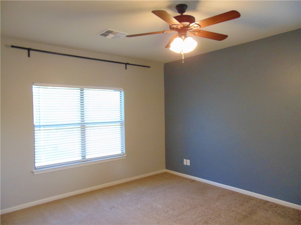 Undisclosed Address Dripping Springs, TX 78620 - Photo 9 of 14 an empty room with a window and a fan