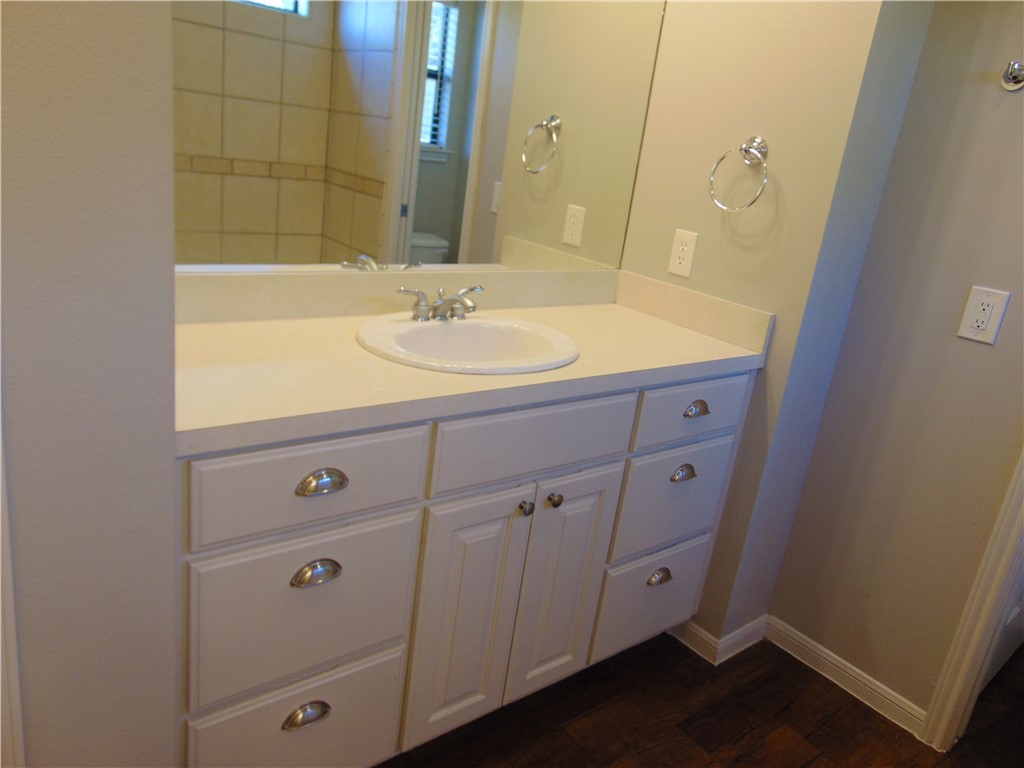 Undisclosed Address Dripping Springs, TX 78620 - Photo 10 of 14 a bathroom with a sink and a mirror