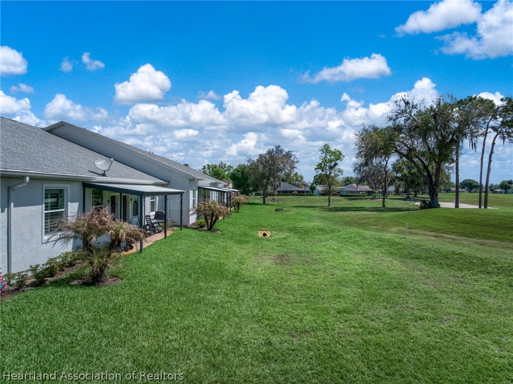 4734 Haw Branch Road, Unit 110 Sebring, FL 33875 - Photo 36 of 50 a view of a house with a yard