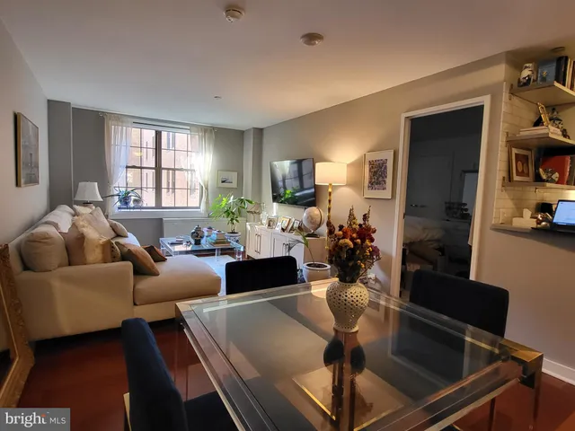 a living room with furniture and a window