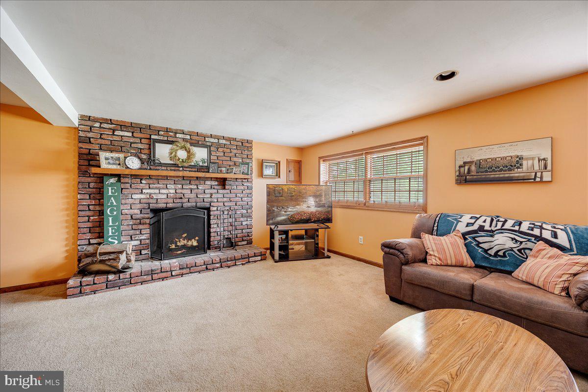519 Bancroft Road Cherry Hill, NJ 08034 - Photo 18 of 28 a living room with furniture and a fireplace