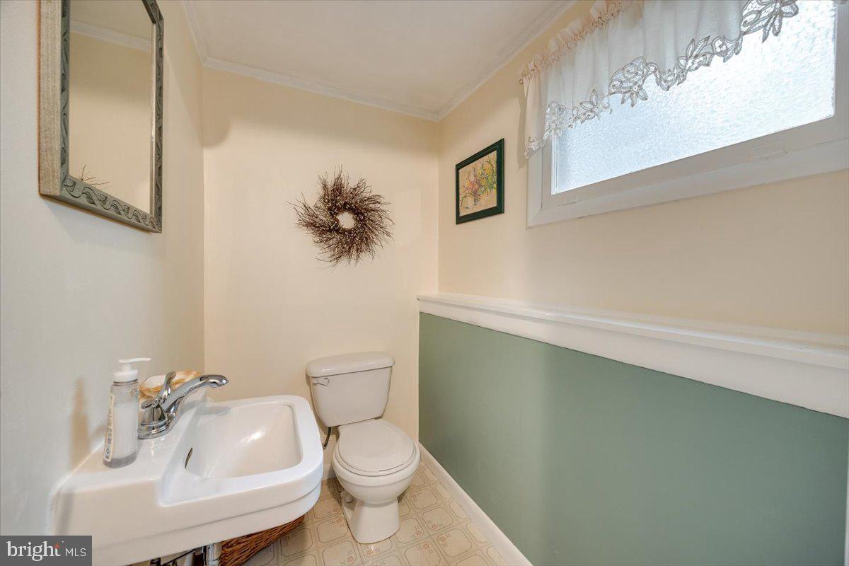 519 Bancroft Road Cherry Hill, NJ 08034 - Photo 22 of 28 a bathroom with a sink mirror vanity and toilet