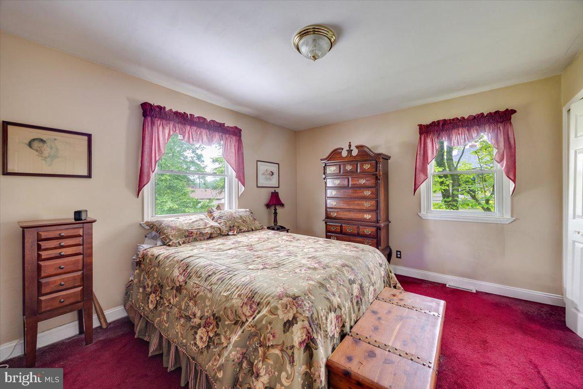 519 Bancroft Road Cherry Hill, NJ 08034 - Photo 23 of 28 a bed sitting in a bedroom next to a window