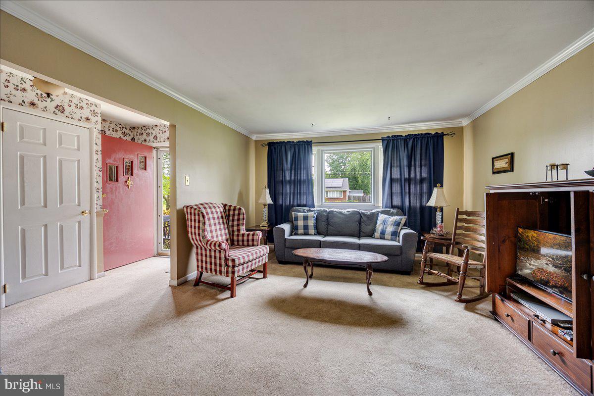 519 Bancroft Road Cherry Hill, NJ 08034 - Photo 6 of 28 a living room with furniture a flat screen tv and a fireplace