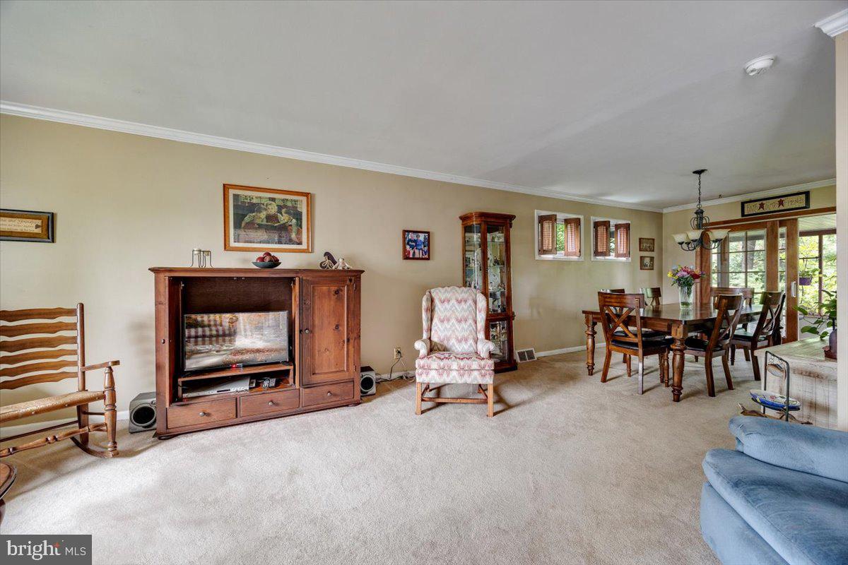 519 Bancroft Road Cherry Hill, NJ 08034 - Photo 8 of 28 a living room with furniture a flat screen tv and a large window