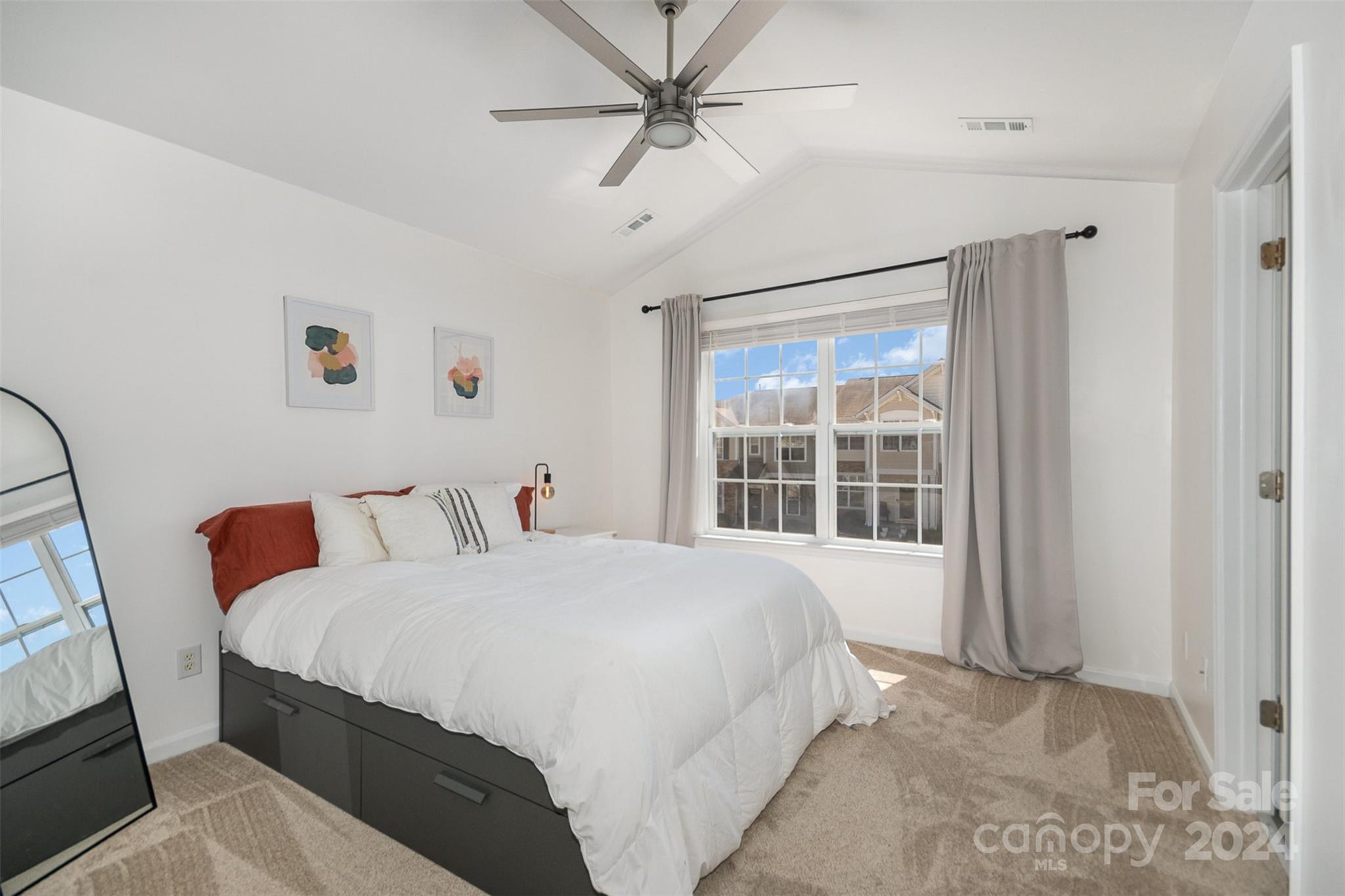 925 Copperstone Lane Fort Mill, SC 29708 - Photo 16 of 27 a bedroom with a large bed and a large window