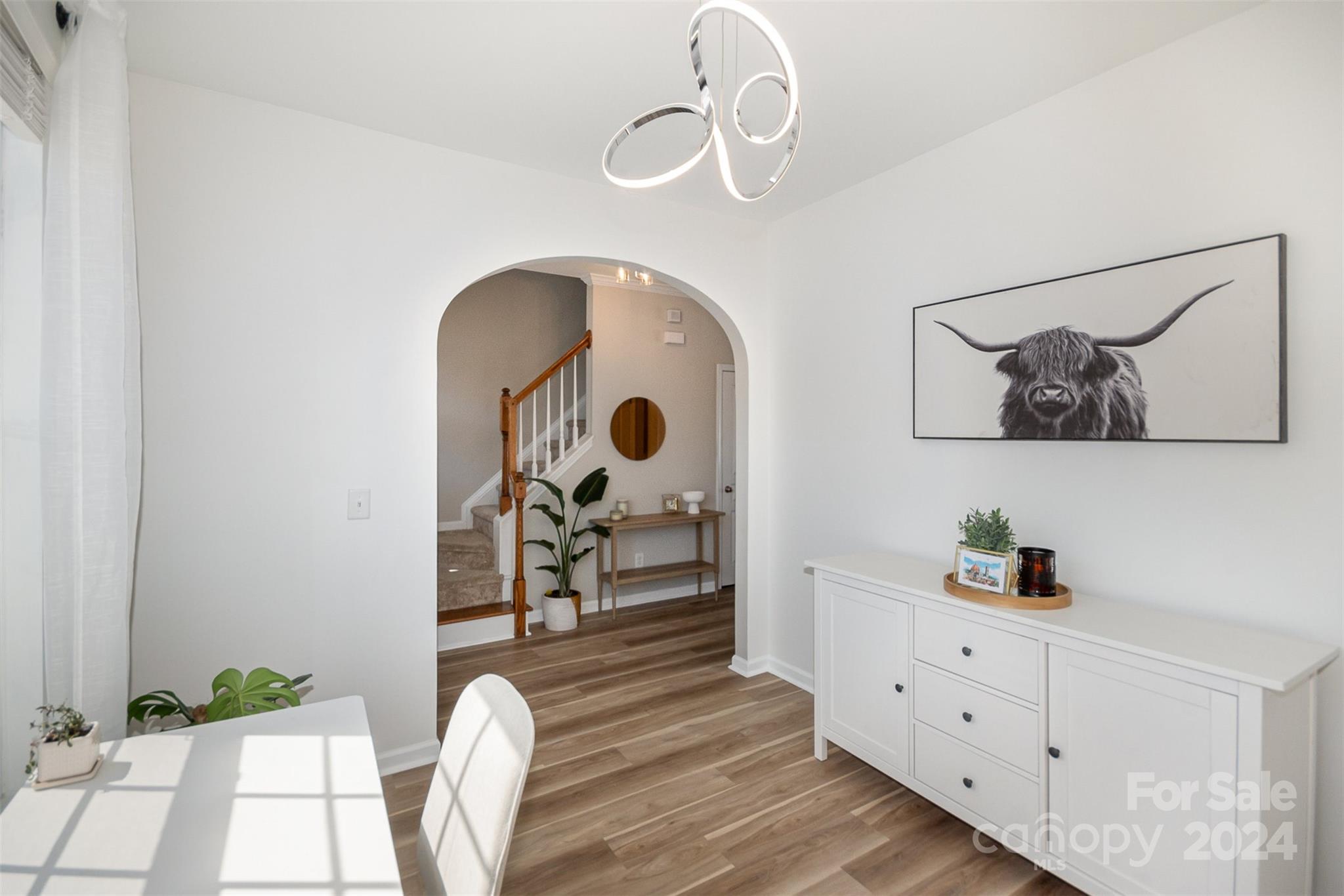 925 Copperstone Lane Fort Mill, SC 29708 - Photo 5 of 27 a bedroom with a bed and a chandelier