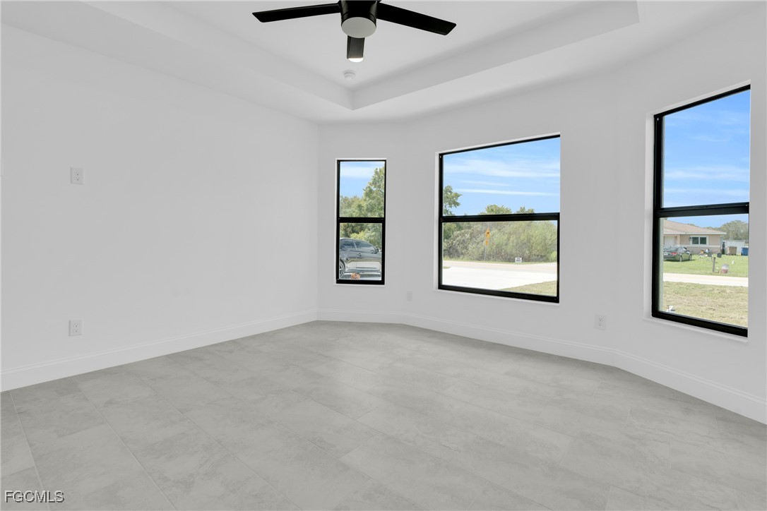 2510 Park Road Lehigh Acres, FL 33971 - Photo 15 of 37 an empty room with windows and fan