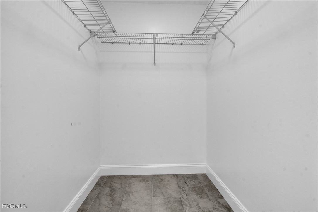 2510 Park Road Lehigh Acres, FL 33971 - Photo 17 of 37 a view of a room with racks on the wall