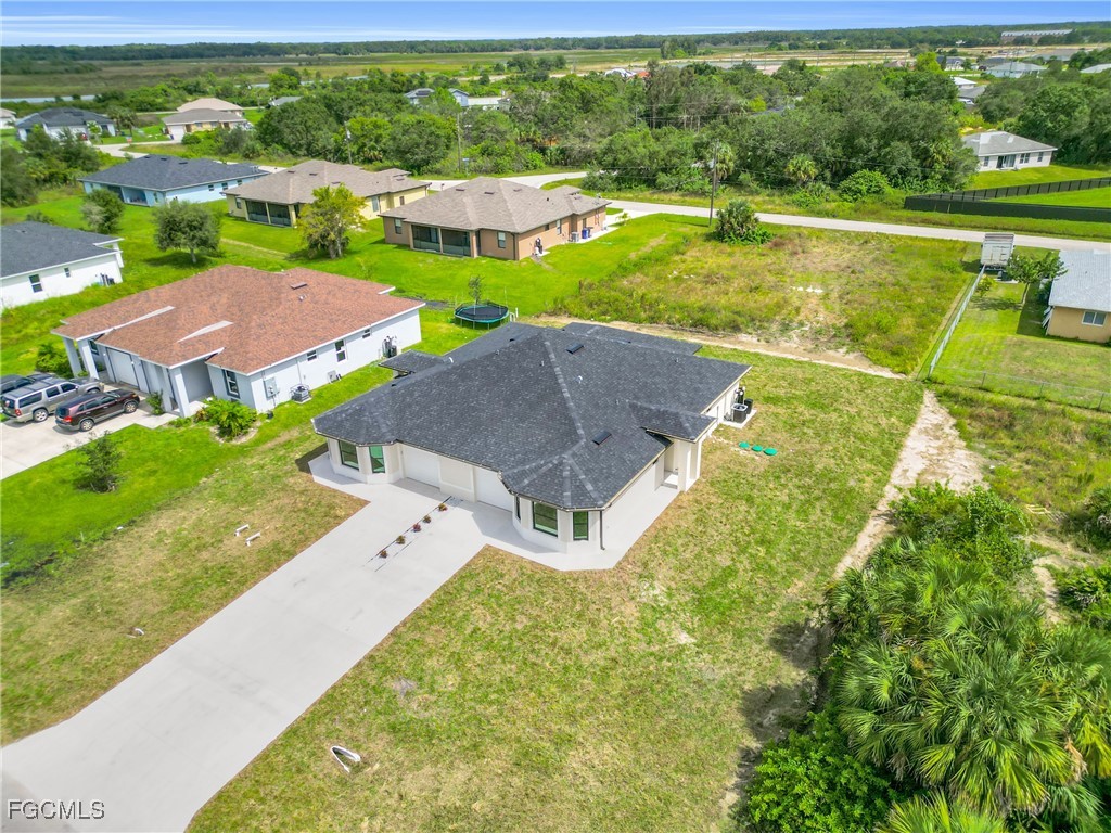 2510 Park Road Lehigh Acres, FL 33971 - Photo 26 of 37 swimming pool view with a garden