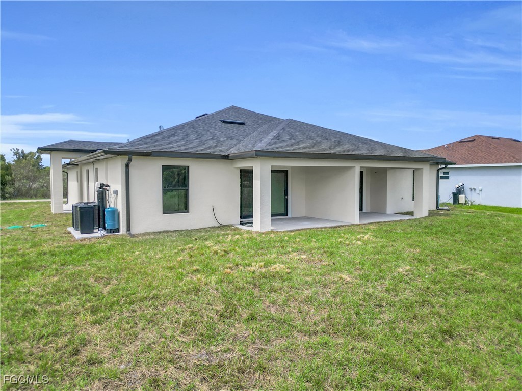 2510 Park Road Lehigh Acres, FL 33971 - Photo 28 of 37 a house view with a garden space