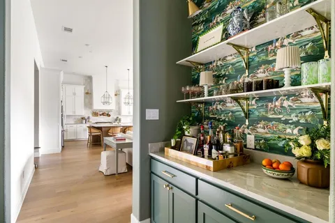 a living room with furniture and a lamp