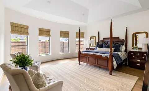 a bathroom with a double vanity sink mirror and shower