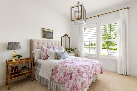 a bedroom with bed and window