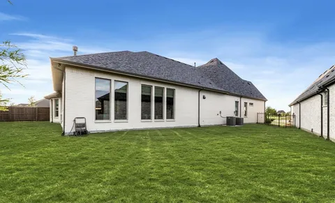 a living room with fireplace furniture and a flat screen tv