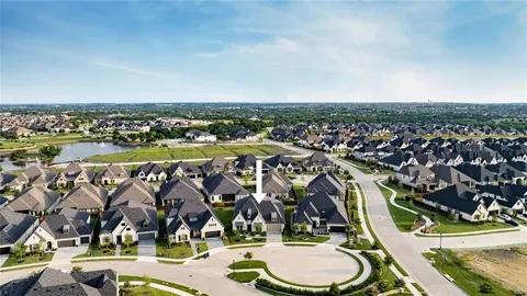 an aerial view of a house with a garden and swimming pool