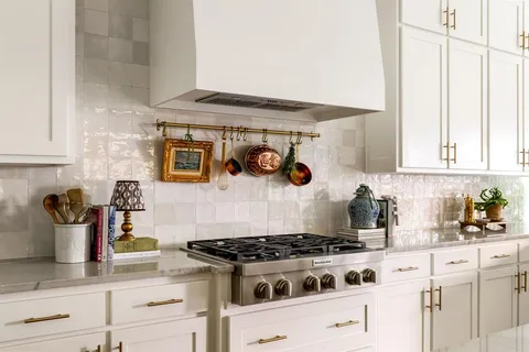 a kitchen with a stove and cabinets