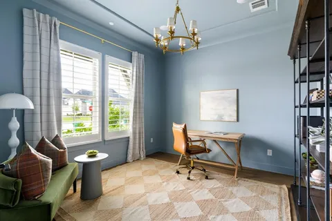 a work room with furniture and a window